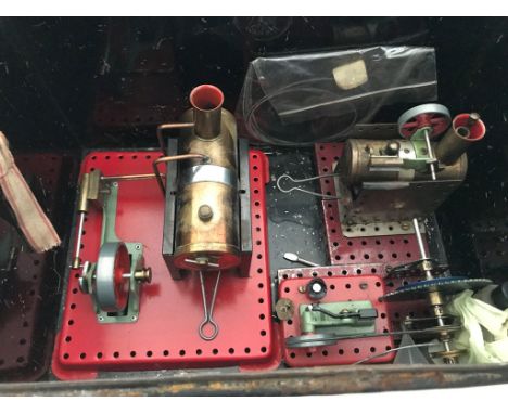 A tin trunk containing three stationary steam engines