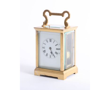 A brass cased carriage clock, with striking movement, gong, white dial with roman numerals, height 18cm (handle up).