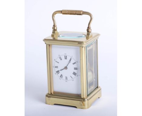 French brass case carriage clock, dial with roman and Arabic numerals, platform escapement, striking on a gong, with key and 