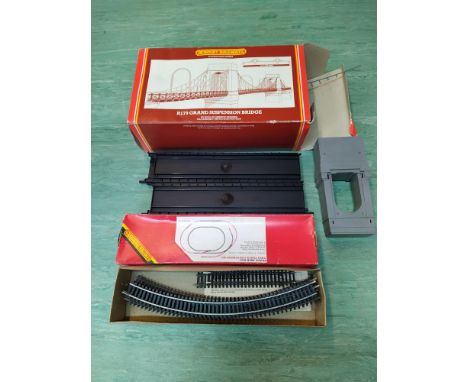 A large selection of boxed Hornby train cars and accessories including suspension bridge, gate keepers hut, caboose, wagons e