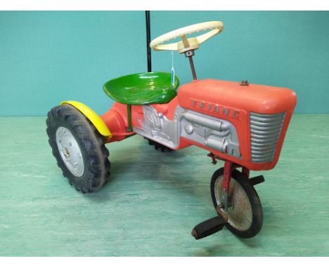 A vintage Triang pedal tractor with metal and plastic body (as found seat)
