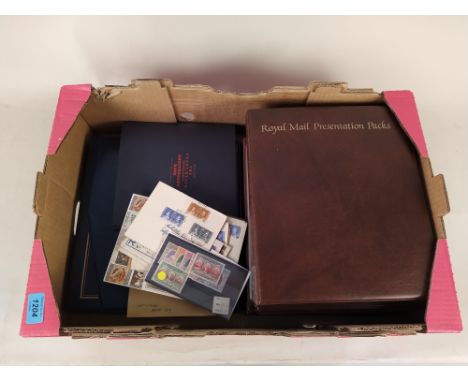 Four albums of first day covers and presentation packs including The Royal Family plus The Penny Black Anniversary book, worl