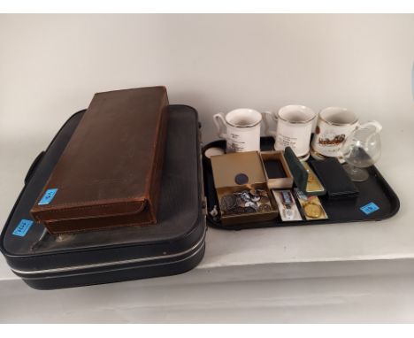 A suitcase with various Masonic regalia and textiles, a small leather case of Masonic books plus mixed Masonic items includin