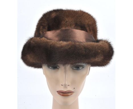 Bespoke-made ladies soft brown mink or possibly sable après-ski fur hat with satin band and bow. Medium sizeCondition Report: