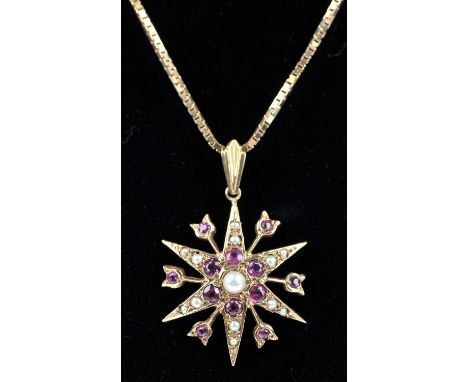 Vintage ruby and seed pearl star pendant, in 9 ct gold, hallmarked London 1973, measures 22mm, on a 9 ct box link chain, with