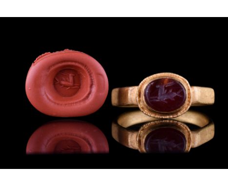Ca. 100-300 AD.An oval-shaped carnelian intaglio engraved with an image of a left-facing stag captured in the running motion,