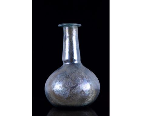 Ca. 100-400 AD.A nice spherical blue glass flask with very attractive iridescence, a folded rim, long tubular neck and a glob