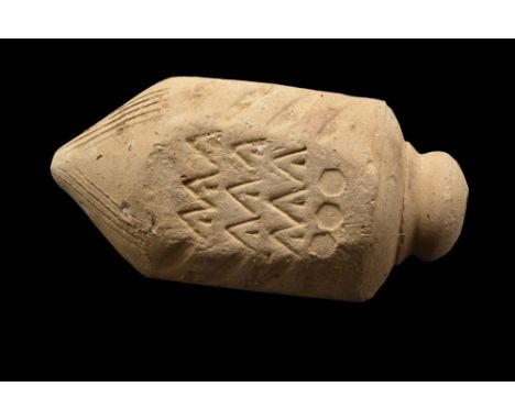 Ca. 900-1200 AD.A cream-coloured "Greek fire" hand grenade comprising a domed lid and a faceted body decorated with linear, c