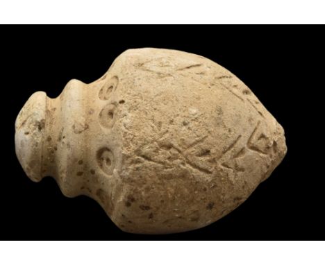 Ca. 900-1200 AD.A ceramic "Greek fire" hand grenade comprising a globular body with a pointed base and a domed lid. The vesse