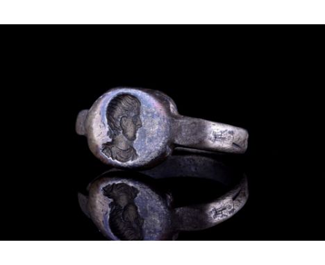 Ca. 400 AD.A D-shaped silver ring with a flat-section hoop and a bezel with an engraved portrait of an Emperor with finely de