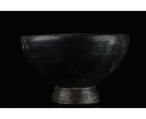 Ca.350 BC.An attractive salt cellar/ small bowl covered in a warm brownish glaze. The vessel features a hemispherical basin w