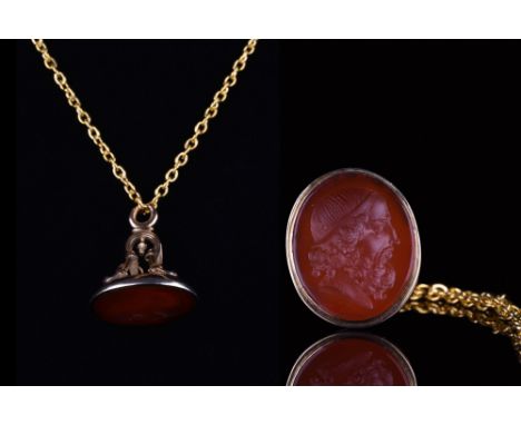 Ca. 1800 AD.A carnelian intaglio with a right-facing portrait of Zeus set in a fob with an oval base and four bars forming an