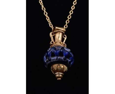 Ca. 323-31 BC.A rare and wonderful miniature amphora-shaped pendant with a cobalt blue glass body, gold conical base, open wo