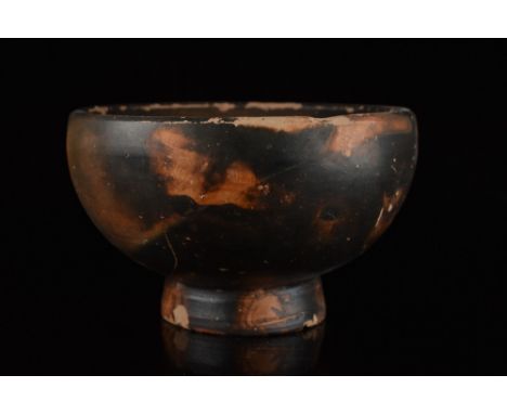 Ca.350 BC.An attractive salt cellar / small bowl covered in a warm brownish glaze. The vessel features a hemispherical basin 