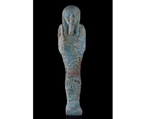 Late Dynastic Period, Ca. 664-332 BC.A mummiform figure in the form of an ushabti, moulded in a light-blue, glazed faience, w