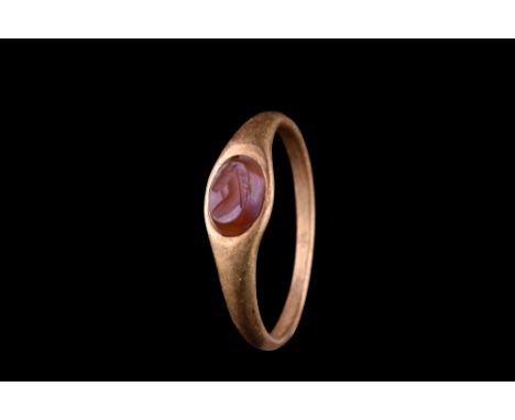 Ca. 100-300 AD.A simple yet elegant gold finger ring composed of a slender hoop slightly widening at the shoulders to form a 