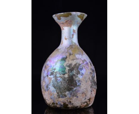 Ca. 200-300 AD.A beautiful yellowish flask comprising a rounded globular body, concave base with a pontil scar, a short strai