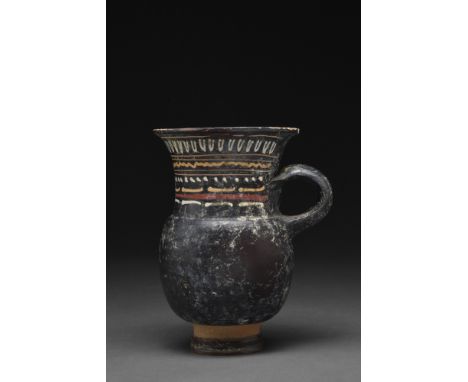 Ca. 350-300 BC.A glazed wheel-thrown thistle mug with a petite tiered foot, a bulbous body that tapers to a wide neck, a flar