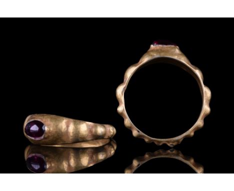 Ca. 100-300 AD.A finely modelled finger ring of a hoop flat inside and with vertically oriented ribbing on the outside. The h