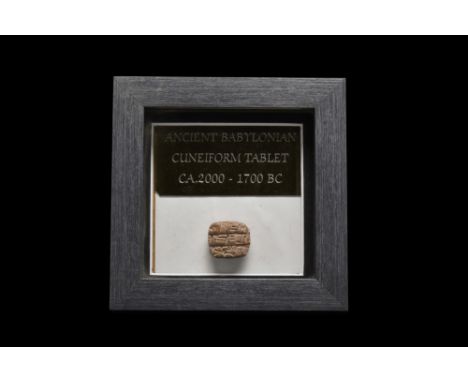 Ca. 2000-1700 AD.A terracotta cuneiform tablet in a light reddish-brown fabric with written script on one side. Cuneiform (fr