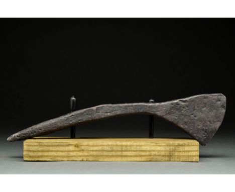 Ca. 900-1100 AD.An iron battle axe with a curved blade, narrow cheek, and an elongated, pointed spike on the reverse. The spi