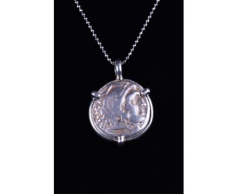 Ca. 295-275 BC.A silver drachm coin of Alexander the Great within a modern handmade circular sterling silver setting. The coi