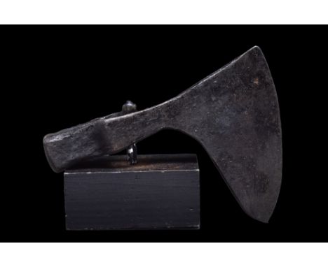 Ca. 900-1100 AD.An iron battle axe with a wide, fan-shaped blade, tapering cheek, heavy poll, and a lozenge-shaped socket. Fo