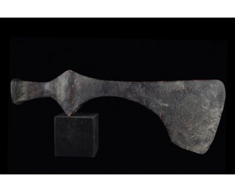 Ca. 900-1100 AD.An iron axe head with a curved blade, slim cheek, elliptical shaft-hole, and a hammer poll. Axes were commonl