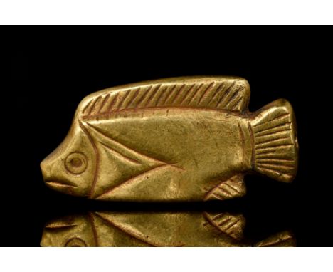 New Kingdom, Ca. 1550-1070 BC.A golden amulet in the shape of a tilapia fish. Fish pendants were worn as jewellery and were b