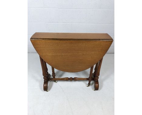 Small Victorian twin drop leaf table on original ceramic castors