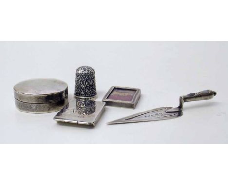 Collection of small silver items including rouge pot, stamp container, thimble, photo frame, trowel etc. Condition report: se