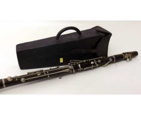 Cased clarinet by Hawkes & Son, London. Condition report: see terms and conditions.