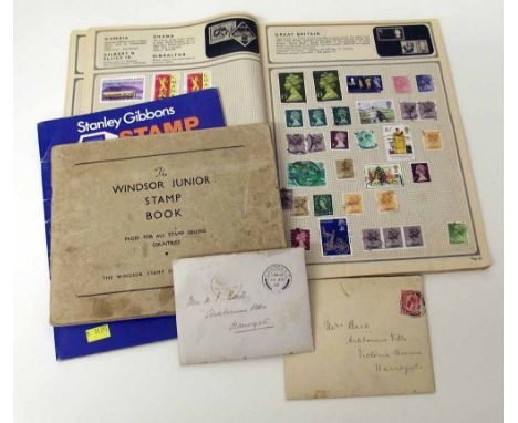 Stamps and postal history, three small albums of stamps, a letter and cover sent on the first day of operation of Britain's f