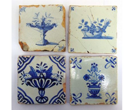 FOUR DELFTWARE TILES  each decorated with baskets and fruit, 12.5cm square