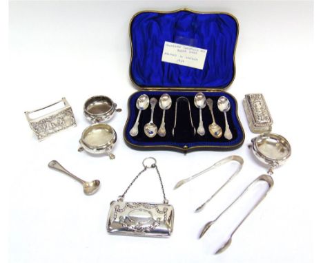 A CASED SET OF SIX SILVER TEASPOONS with tongs, by Wakely & Wheeler, London 1909; a glass pin box with silver pull off cover;