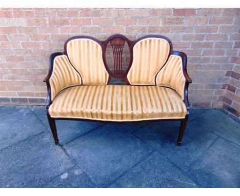 AN EDWARDIAN MAHOGANY FRAMED TWO SEATER SALON SOFA,  with line inlaid and marquetry decoration, on square tapering supports w