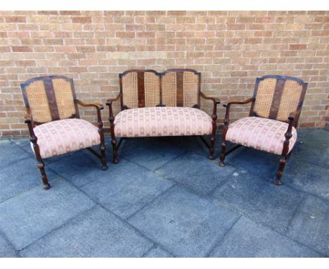 AN EARLY 20TH CENTURY THREE PIECE BERGERE SUITE,  the sofa 109cm wide 70cm deep 85cm high
