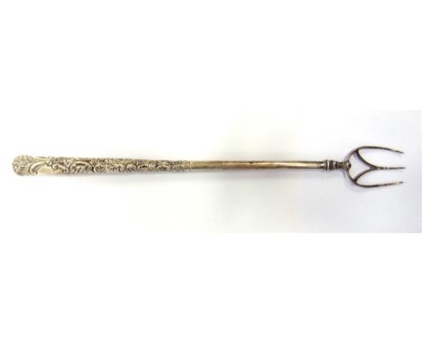 A LATE VICTORIAN SILVER TOASTING FORK  by John Henry Rawlings, London 1894, with an embossed handle, 29cm long, 51g gross