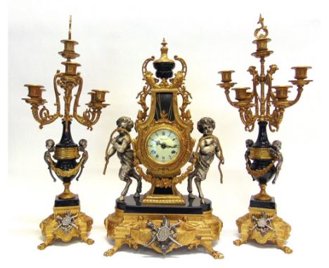 A LARGE GILT METAL MOUNTED CLOCK GARNITURE  in the Empire style, the enamel dial signed Imperial, the 8-day German movement s