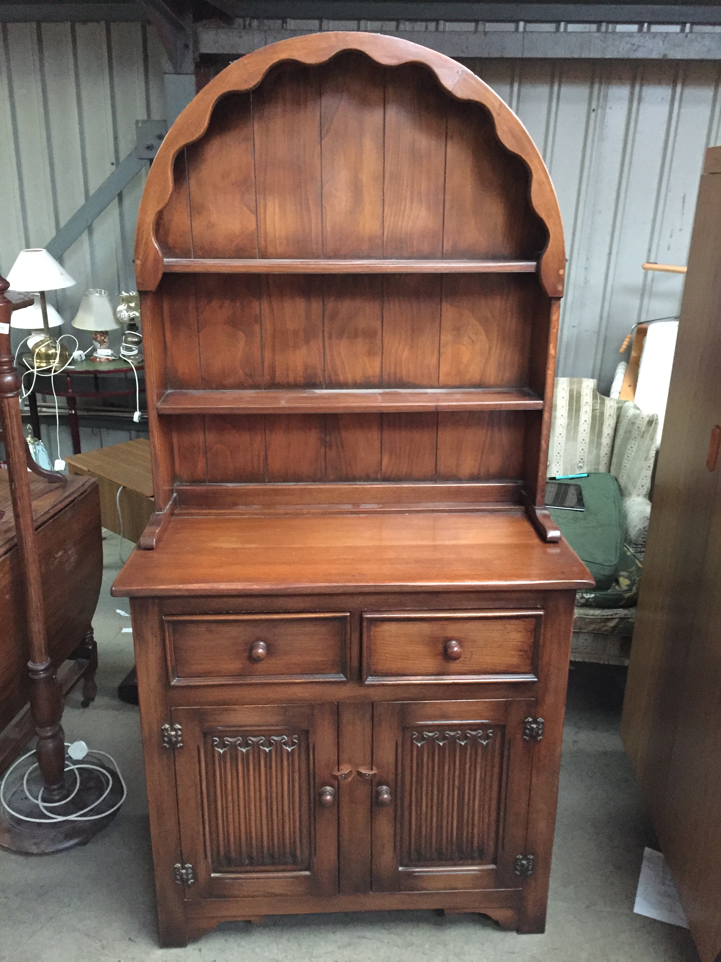 A Linen Fold Welsh Dresser With Rounded Top Having Two Shelves