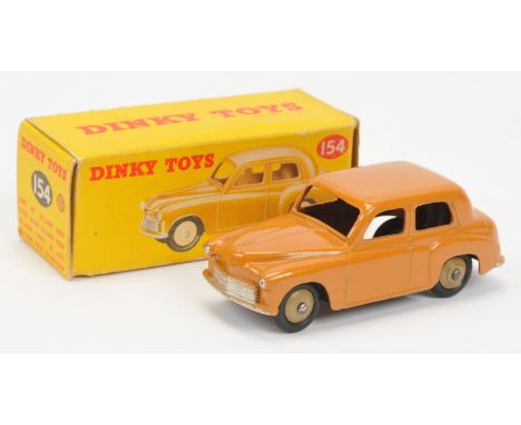 Dinky Toys 154 Hillman Minx - tan body, silver trim, light beige rigid hubs with black smooth tyres. Condition is Excellent P