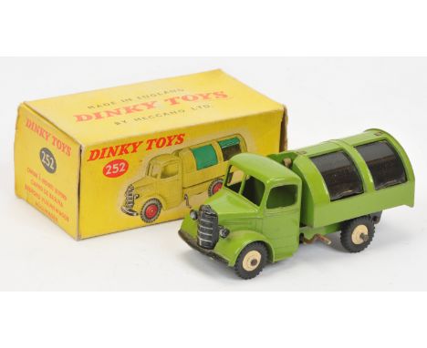 Dinky Toys 252 Bedford Refuse Wagon - green body, black metal slides, light beige ridged hubs with black treaded tyres, witho