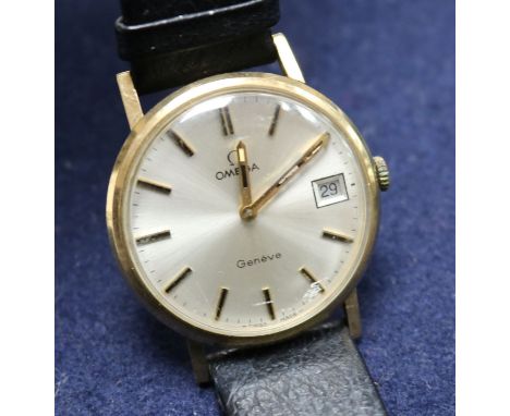 A gentleman's gold Omega manual wind wrist watch.