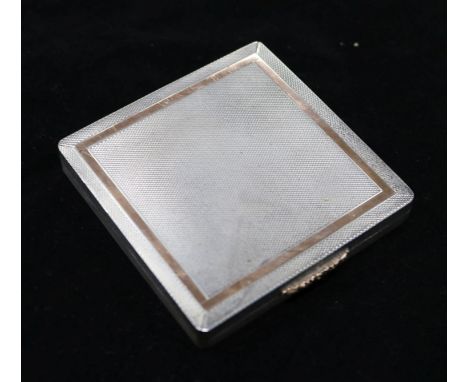 An engine turned silver compact, 2.75in.