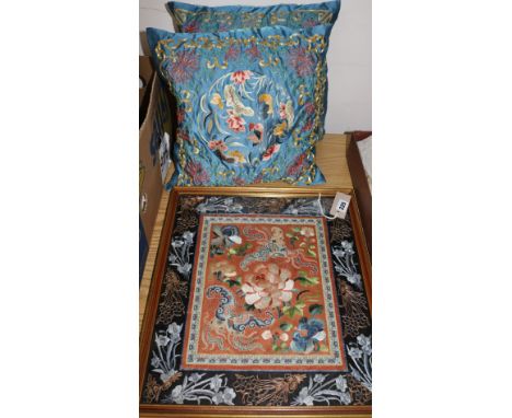 A Chinese silk-embroidered panel (framed) and two similar cushions