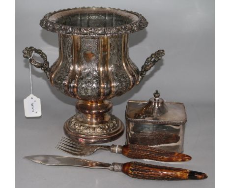 A 19th century plated campana urn-shaped wine cooler, a plated tea caddy and a pair of fish servers with antler handles