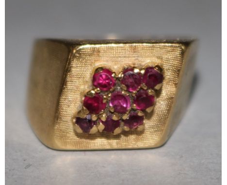 An 18ct gold and ruby cluster cocktail ring, size K.