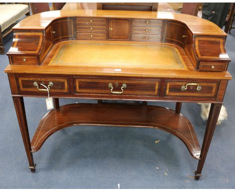 A Carlton House style inlaid mahogany desk, W.114cm