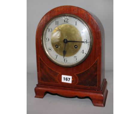 An Edwardian inlaid mahogany eight day mantel clock