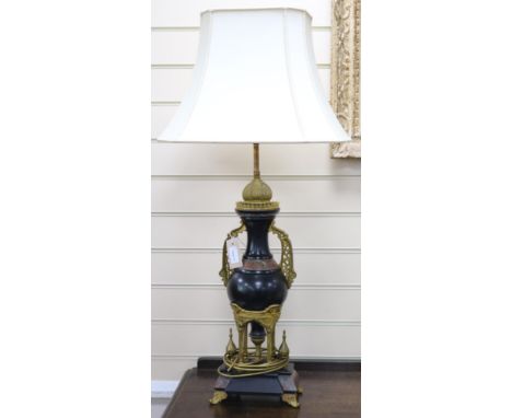 A pair of 19th century ormolu and marble table lamps, of architectural form (converted to electricity), H.62cm